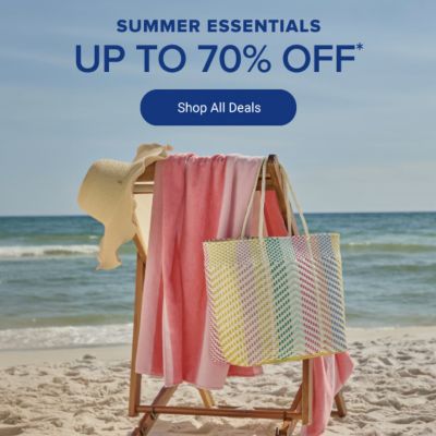A beach chair with a hat, towel and bag hanging from it. Summer essentials. Up to 70% off. Shop all deals.