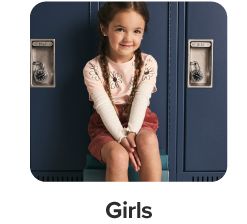 A girl in a flower shirt and red shorts. Shop girls.