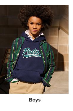 A boy in a blue Polo hoodie and striped blazer. Shop boys.