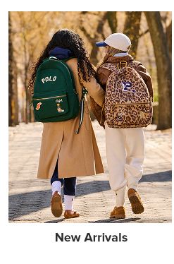 A boy and girl wearing Polo backpacks. Shop new arrivals.