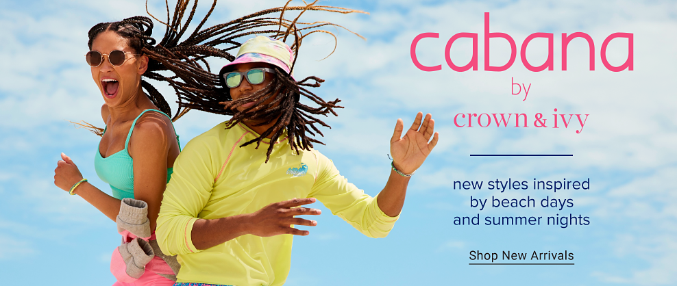A young woman jumping happily in the air wearing round sunglasses, a mint green spaghetti strap top, pink biking shorts with a pink and grey jacket tied around her waist. A young man jumping happily in the air wearing mirrored sunglasses, a pink and yellow bucket hat, a yellow tee shirt and blue, green, pink and yellow board shorts. Cabana by Crown and Ivy. New styles inspired by beach days and summer nights. Shop new arrivals.