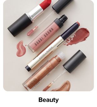 Various lipsticks and lip glosses. Shop beauty.