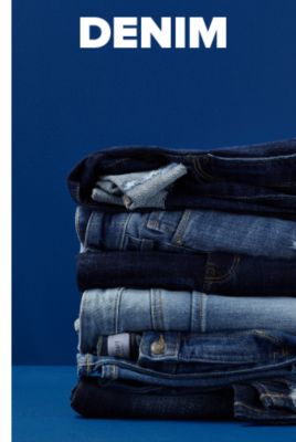 A GIF showing jeans being stacked on top of each other. Denim. 