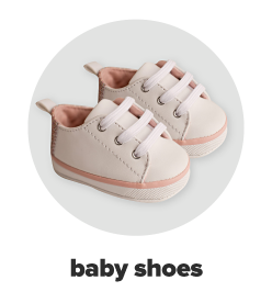 A tiny pair of pink canvas sneakers. Baby shoes.