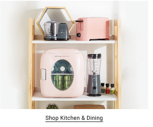 A shelf with a small light pink refrigerator, a blender and a light pink toaster. Shop kitchen and dining.