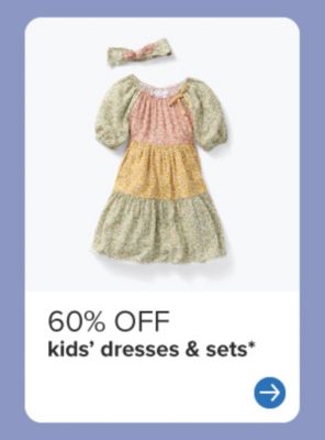 A girls' patterned dress. 60% off kids' dresses & sets. 