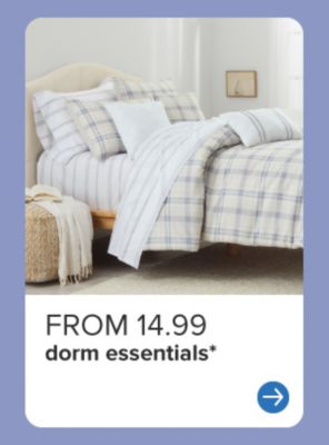 A bed with plaid bedding. From 12.99 dorm essentials. 