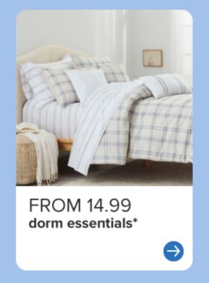 A bed with plaid bedding. From 12.99 dorm essentials. 