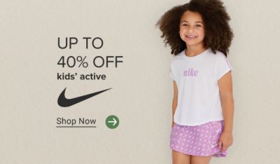Up to 40% off kids’ active. Nike logo. Shop Now. A girl in a pink skirt and Nike shirt.
