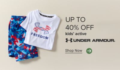 Up to 40% off kids’ active. Under Armour logo. Red white and blue shorts and an Under Armour t-shirt. Shop now.