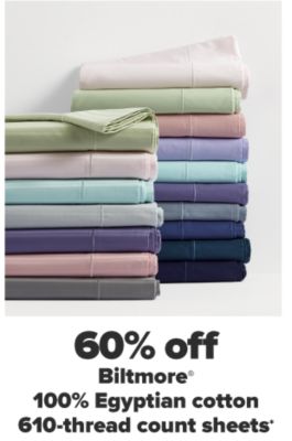 Two stacks of folded sheets in a variety of colors. 60% off Biltmore 100% Egyptian cotton 610 thread count sheets. 