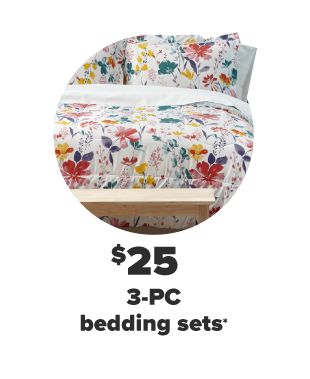 A white bedding set with bright flowers in red, yellow, green and blue. $25 3-PC bedding sets. 