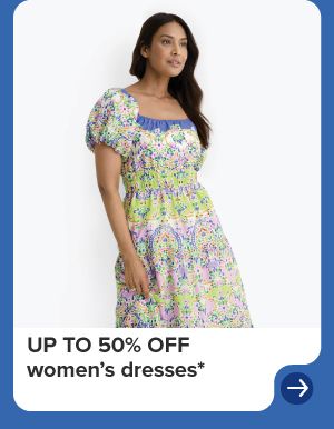 A woman in a tiered floral dress. Up to 50% off women's dresses. 
