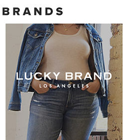 A woman wearing a denim jacket with an American flag on the back. Lucky Brand. 