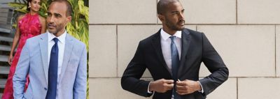 An image of a man wearing a black suit and tie.
