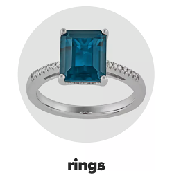A blue topaz and white gold ring. Rings.