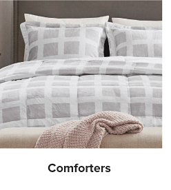 White and gray gridded bedding. Comforters 