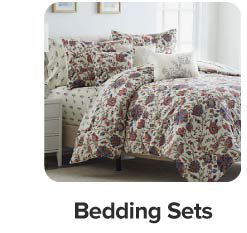 Image of a bed with floral bedding. Shop bedding sets.