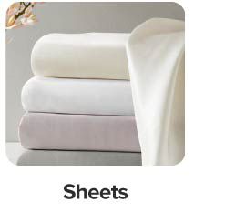 Image of a stack of folded sheets. Shop sheets.