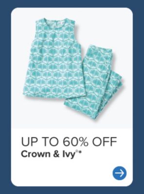 60% off Crown and Ivy. Woman wearing navy floral dress. 
