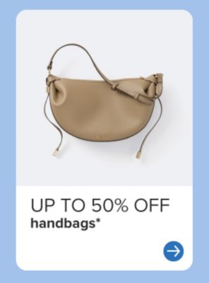 Up to 50% off handbags. Tan purse. 