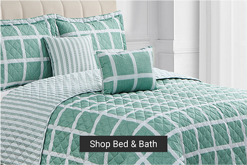 A green and white striped quilted bedspread. Shop bed and bath