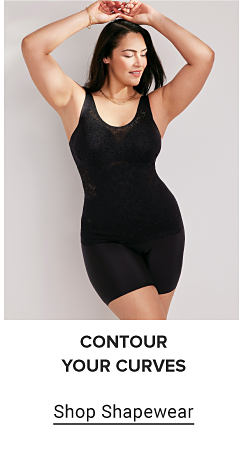 A woman in black shapewear. Contour your curves. Shop shapewear.