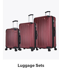 Image of three matching red rolling suitcases. Shop luggage sets. 