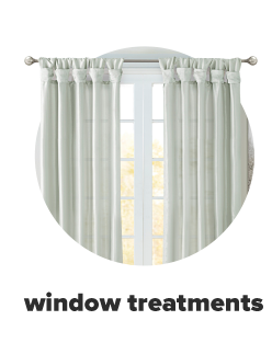 Light green curtains with ruffles at the top. Window treatments.