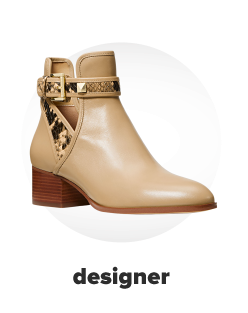 A tan ankle bootie with gold accents on the strap. Designer. 