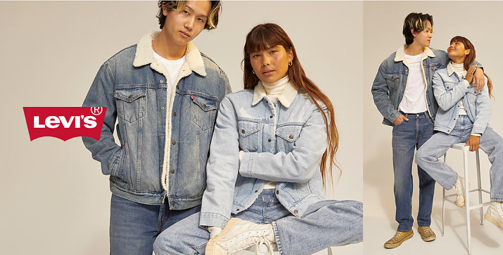 A man and woman, both wearing Levi's trucker jackets and jeans. Levi's.
