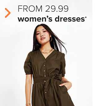A woman in a dark green button-down tunic dress. From 29.99 women's dresses. 