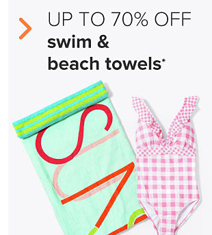 A light green beach towel and a pink gingham one piece women's bathing suit. Up to 70% off women's and men's swim and beach towels. 