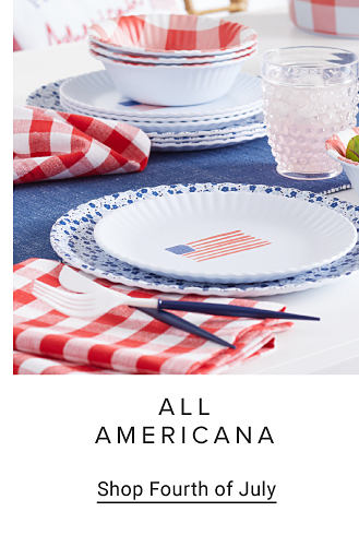 Americana dinnerware on a blue tablecloth. All Americana. Shop Fourth of July.