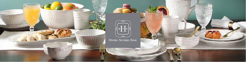 An assortment of white and crystal dinnerware from Modern Southern Home. 