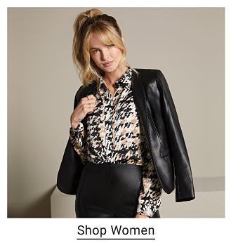 An image of a woman wearing a skirt suit. Shop women. 