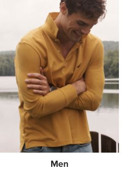 An image of a man wearing a yellow long sleeve shirt. Shop men.