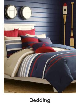 An image of a bedroom featuring a bed with Nautica bedding. Shop bedding.