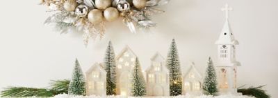 An image featuring a wreath and tabletop holiday decor.