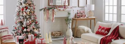 An image of a living room and Christmas tree decorated for Christmas.