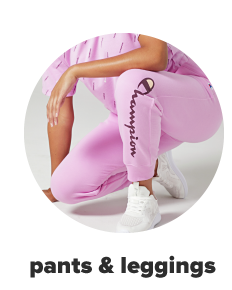 A woman wears pink Champion jogger pants. Shop pants and leggings.