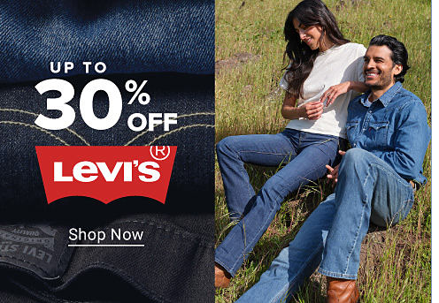 Stacks of folded blue jeans. A man and a woman in Levi's jeans. Up to 30% off Levi's. Shop now. 