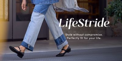 Image of a woman walking and wearing a denim jacket, jeans and black mary janes. Lifestride logo. Style without compromise. Perfect fit for your life.