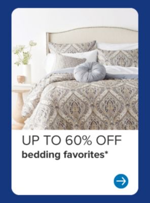 Image of a bed. Up to 60% off bedding favorites.