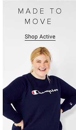 Woman wearing a navy blue Champion long sleeve. Made to move. Shop active.