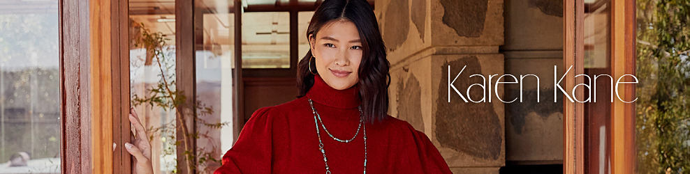 Woman wearing a red turtleneck and beaded necklace. Karen Kane. Shop now. 