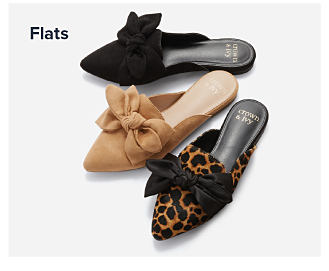 An image of flats in brown, tan and leopard print. Shop flats.