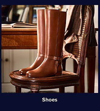 An image of a pair of brown leather boots. Shop shoes.