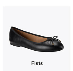 A black flat shoe. Shop flats.