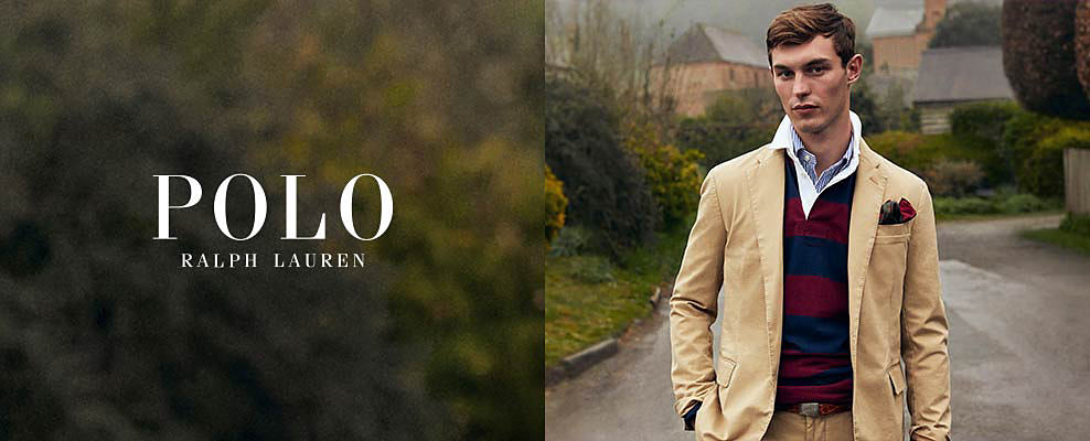 A man holds up a boy, who is looking through a pair of binoculars. Shop Polo Ralph Lauren.